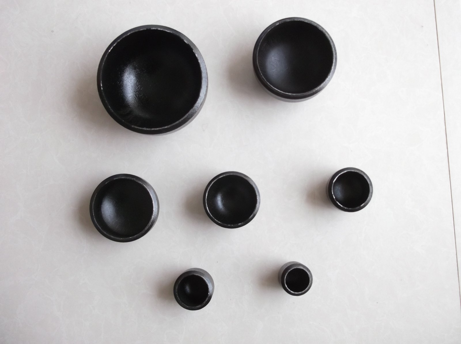 Butt-weld pipe caps, assorted sizes – Elbows and fittings